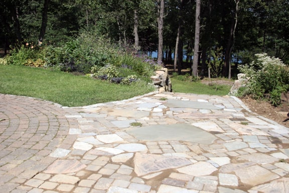Once the work is finished, a stone path and patio will be there for years to come.
