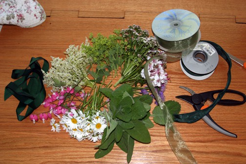 The flowers I picked tonight were oxeye daisies, bleeding heart, Persicaria polymorpha, lady's mantle, Valeriana officinalis, Geranium cantibrigensis, and mint or sage leaves.  